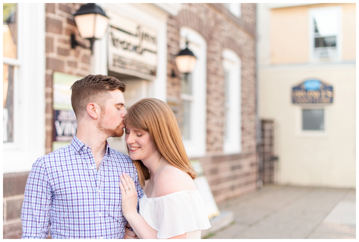 Fiance kissing his girlfriend on forehead in Doylestown